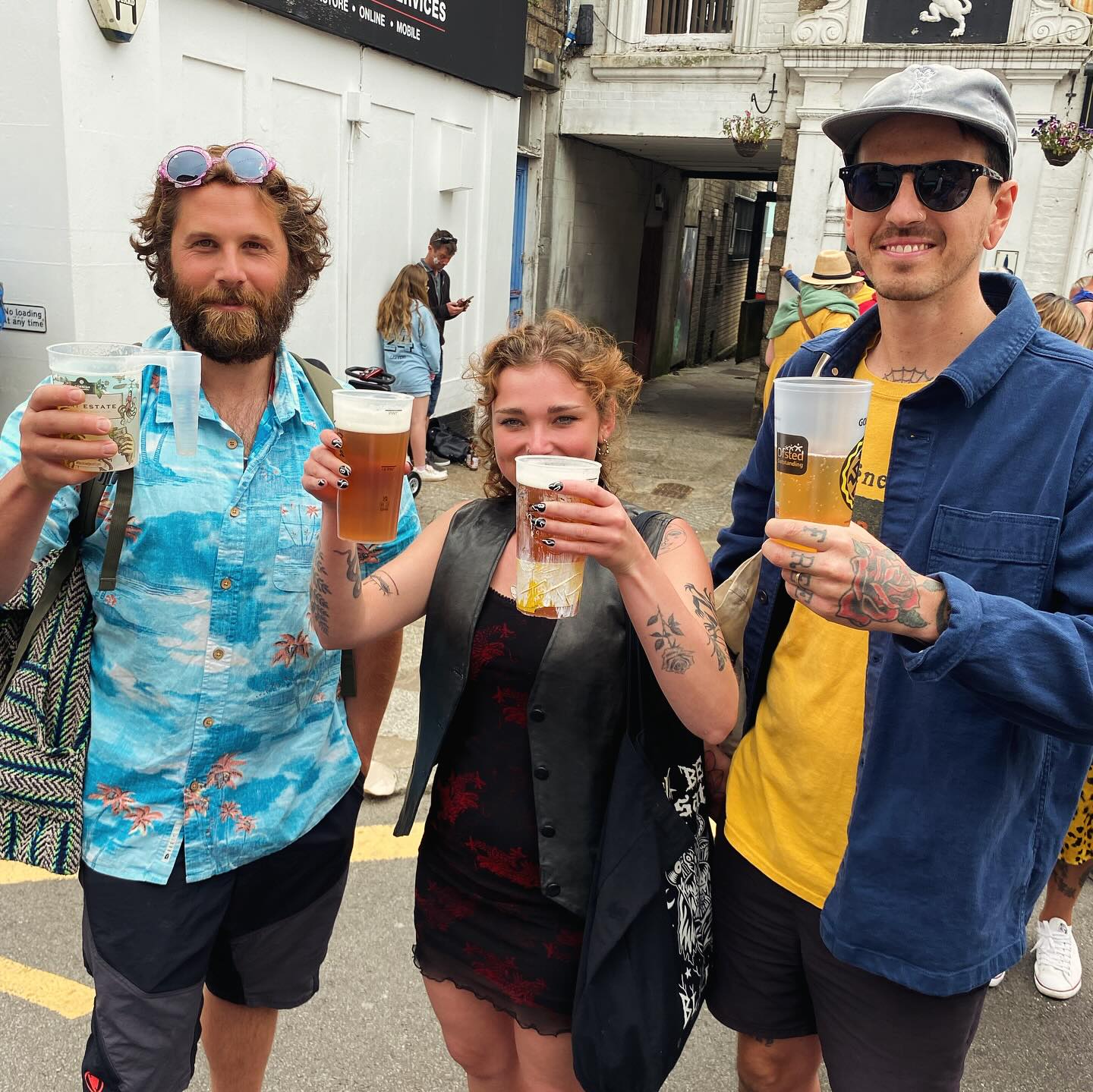 two men and a women with reuseable cups
